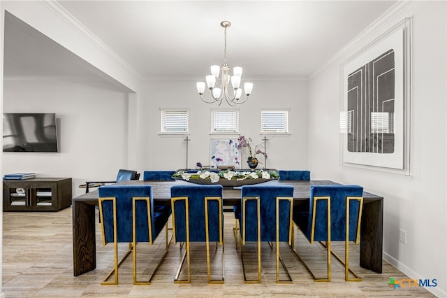 dining room featuring a chandelier and crown molding