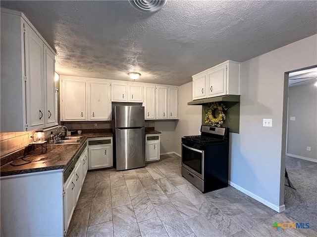 kitchen with sink, white cabinets, and stainless steel appliances