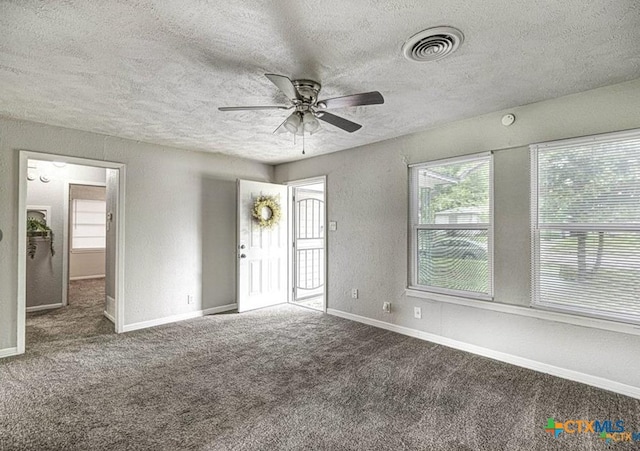 spare room with carpet floors and ceiling fan