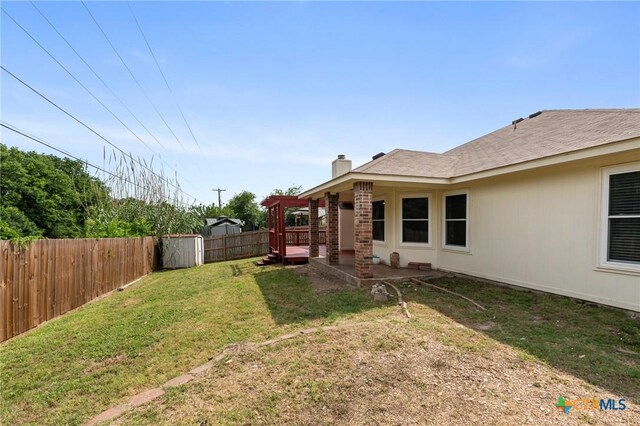 view of yard with a patio and a fenced backyard