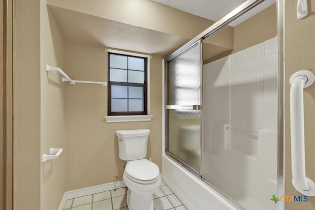 bathroom featuring a textured ceiling, bath / shower combo with glass door, tile patterned floors, and toilet