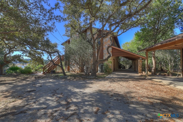 exterior space with a carport