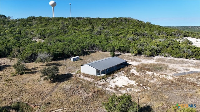 entry to storm shelter with an outbuilding