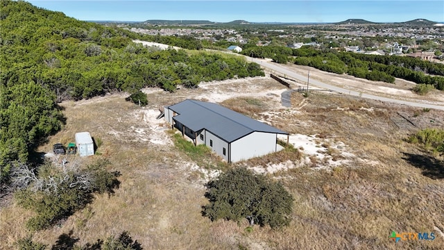 birds eye view of property featuring a mountain view