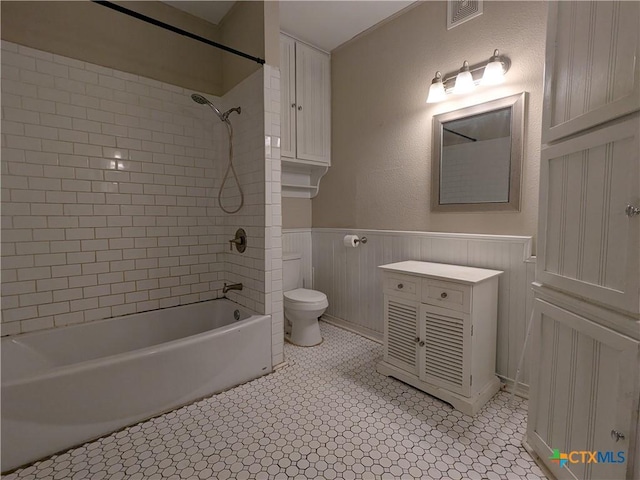 207 W 5th St, Lampasas, TX 76550 - bathroom with shower / bathtub combination, wainscoting, and vanity