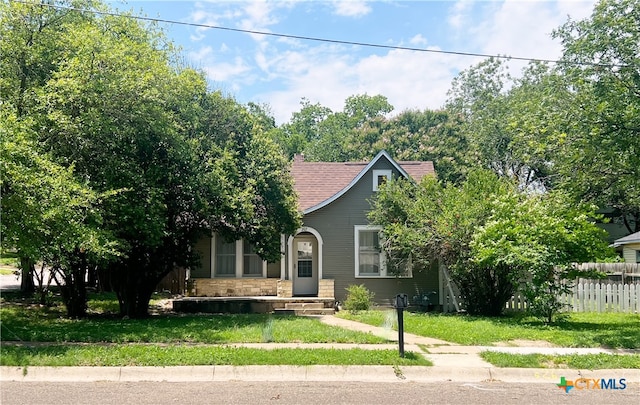 207 W 5th St, Lampasas, TX 76550 - obstructed view of property featuring stone siding