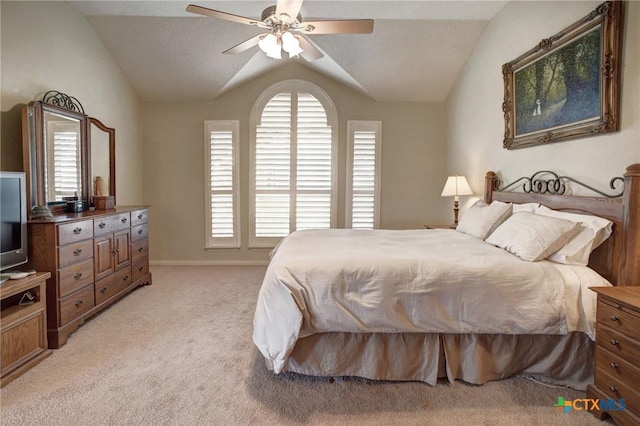 bedroom featuring lofted ceiling, light carpet, ceiling fan, and baseboards