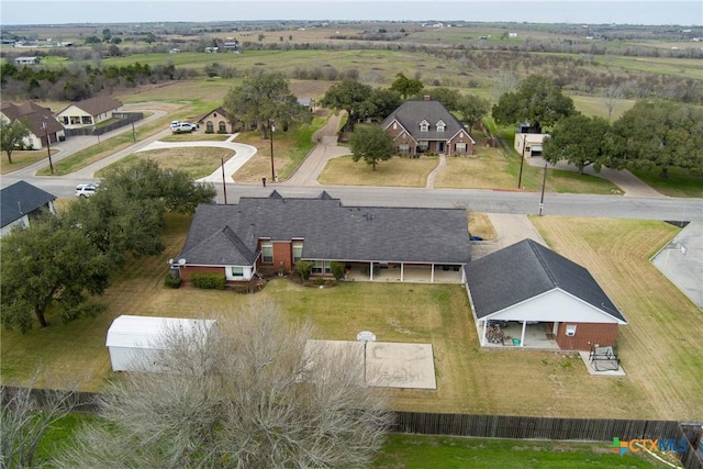 birds eye view of property with a residential view