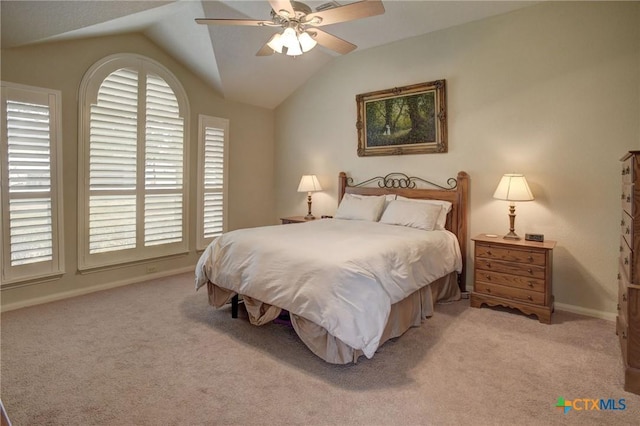 bedroom with light carpet, ceiling fan, baseboards, and lofted ceiling