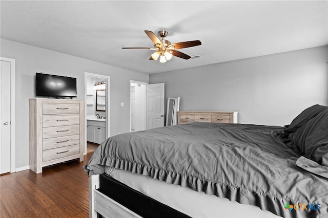 913 Risen Star Ln, Copperas Cove, TX 76522 - bedroom with dark wood finished floors, ensuite bath, a ceiling fan, baseboards, and a sink