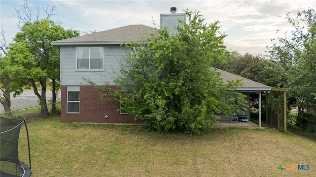 913 Risen Star Ln, Copperas Cove, TX 76522 - back of property featuring a patio area, brick siding, and a chimney