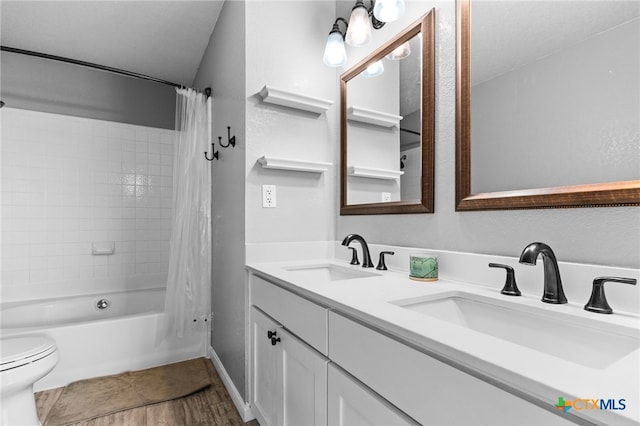 913 Risen Star Ln, Copperas Cove, TX 76522 - bathroom featuring toilet, double vanity, shower / tub combo with curtain, and wood finished floors