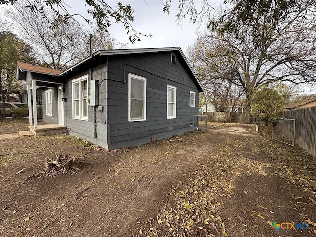 view of home's exterior featuring fence