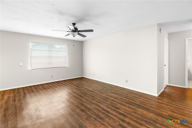 unfurnished room featuring dark hardwood / wood-style floors and ceiling fan