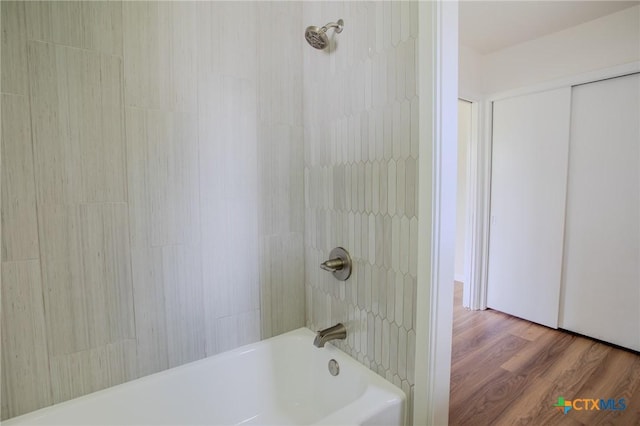 2906 Arroyo Dr, Victoria, TX 77901 - bathroom featuring shower / bathtub combination and wood finished floors