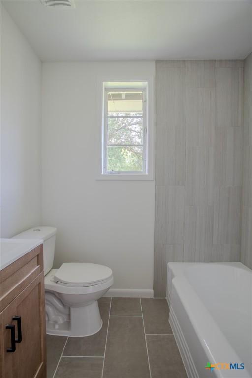 2906 Arroyo Dr, Victoria, TX 77901 - bathroom with vanity, a tub, tile patterned floors, and a shower