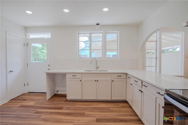 2906 Arroyo Dr, Victoria, TX 77901 - kitchen with light wood-style floors, light countertops, recessed lighting, white cabinets, and stainless steel electric range
