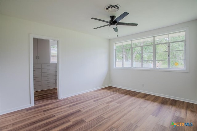 2906 Arroyo Dr, Victoria, TX 77901 - spare room featuring plenty of natural light, light wood finished floors, and a ceiling fan