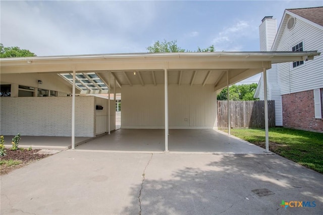 2906 Arroyo Dr, Victoria, TX 77901 - view of parking with driveway and a carport