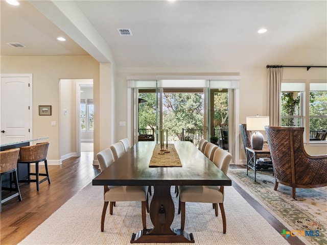 121 Wild Honeysuckle Way, San Marcos, TX 78666 - dining room with wood finished floors, recessed lighting, and baseboards