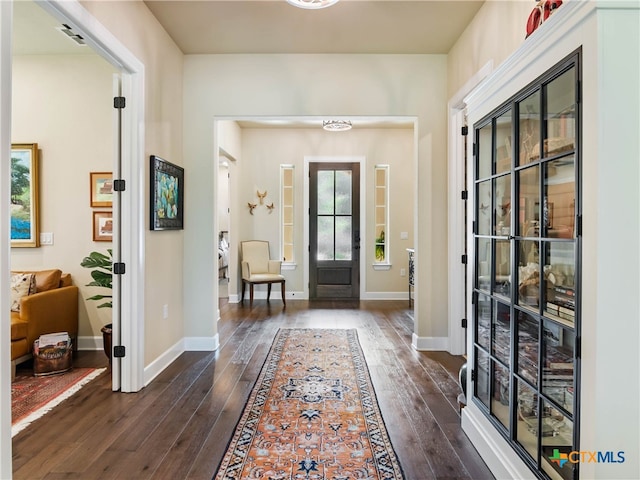 121 Wild Honeysuckle Way, San Marcos, TX 78666 - entryway featuring dark wood-style flooring and baseboards