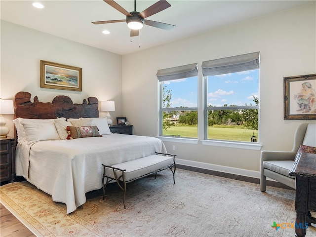121 Wild Honeysuckle Way, San Marcos, TX 78666 - bedroom with light wood finished floors, recessed lighting, baseboards, and ceiling fan