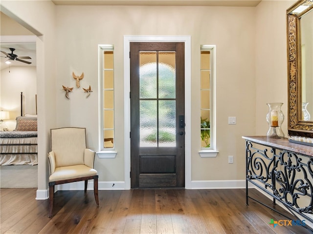 121 Wild Honeysuckle Way, San Marcos, TX 78666 - entrance foyer featuring dark wood-style flooring, baseboards, and a ceiling fan