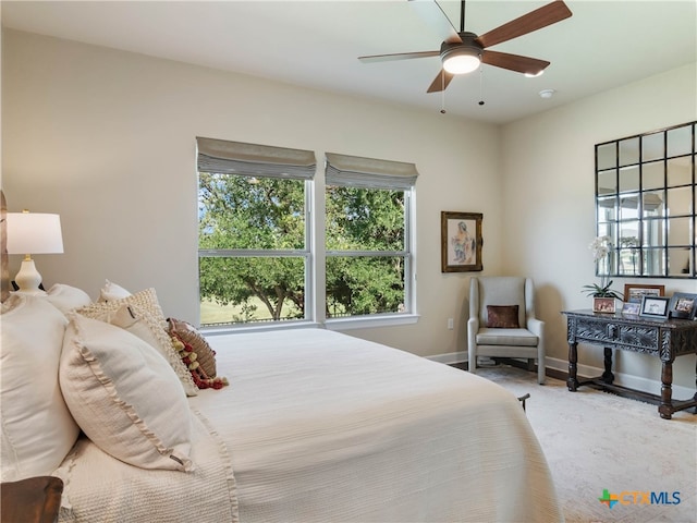 121 Wild Honeysuckle Way, San Marcos, TX 78666 - bedroom featuring baseboards, wood finished floors, and ceiling fan