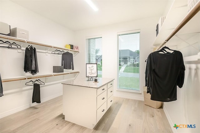 spacious closet featuring light wood-type flooring
