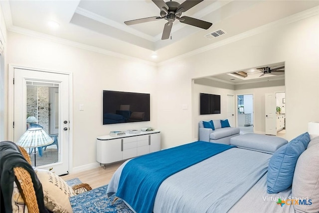 bedroom with visible vents, a raised ceiling, crown molding, and access to outside