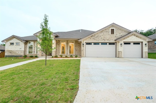 view of front of home featuring concrete driveway, an attached garage, and a front lawn