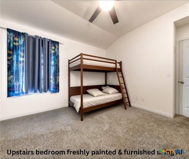 unfurnished bedroom with ceiling fan, carpet, and lofted ceiling