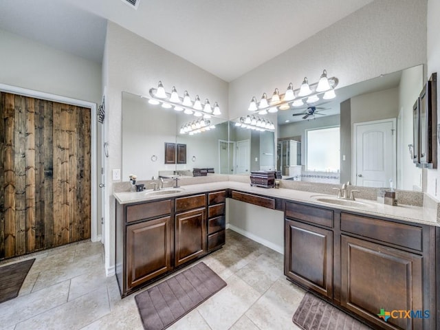 bathroom with ceiling fan, tile patterned floors, and vanity