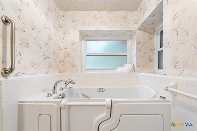 3927 Amanda Dr, Salado, TX 76571 - full bathroom featuring wallpapered walls and a bath