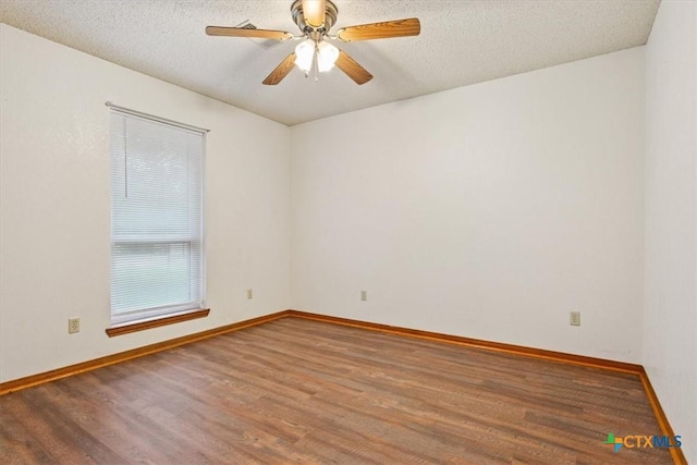 3927 Amanda Dr, Salado, TX 76571 - unfurnished room featuring wood finished floors, a textured ceiling, and a ceiling fan