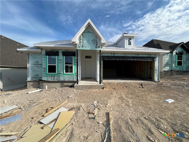 property in mid-construction with a garage