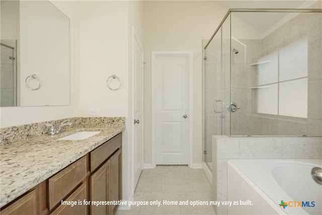 bathroom with shower with separate bathtub, vanity, and tile patterned floors