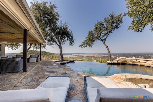 view of patio with a water view