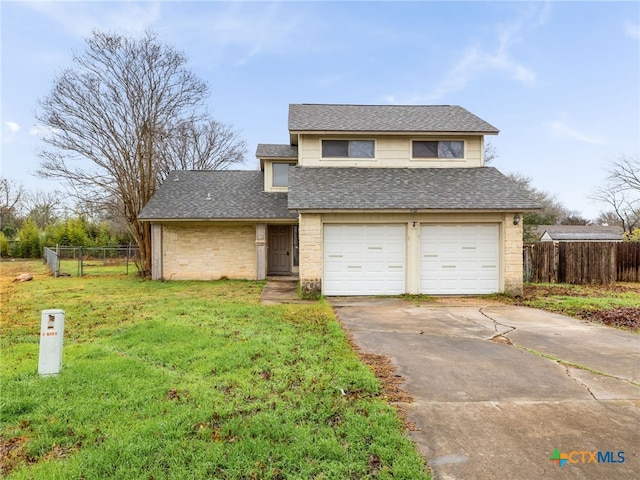 front of property with a garage and a front lawn