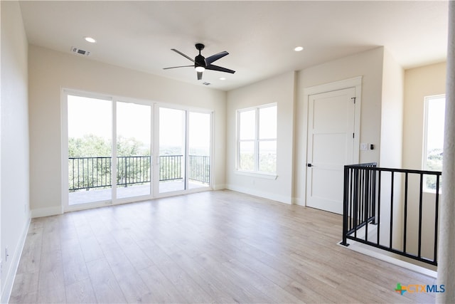 unfurnished room featuring ceiling fan and light hardwood / wood-style floors