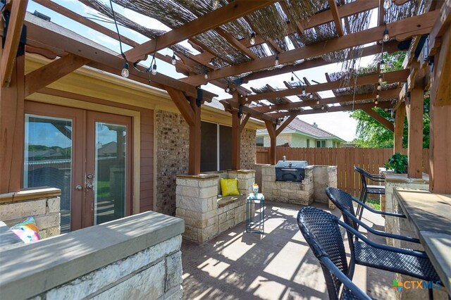 1127 Chaucer Ln, Harker Heights, TX 76548 - view of patio / terrace featuring exterior kitchen, french doors, and a pergola