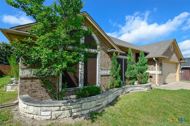 1127 Chaucer Ln, Harker Heights, TX 76548 - view of front of home with brick siding, a garage, a front yard, and concrete driveway