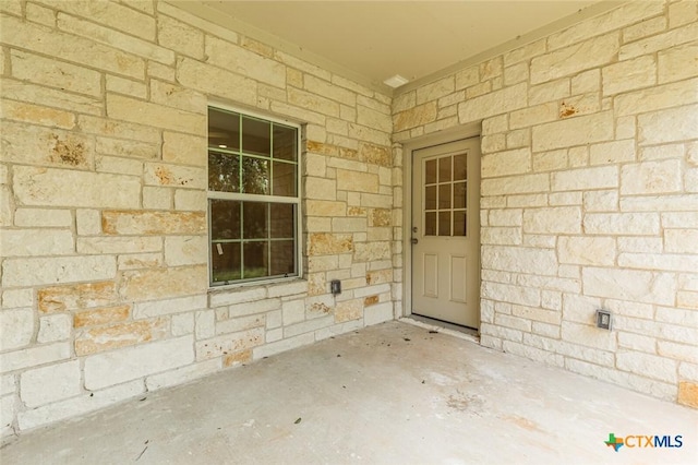 1700 Proctor Ave, Waco, TX 76708 - doorway to property featuring stone siding