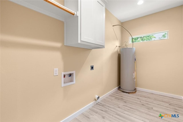 1700 Proctor Ave, Waco, TX 76708 - laundry area featuring cabinet space, water heater, electric dryer hookup, light wood-style floors, and hookup for a washing machine