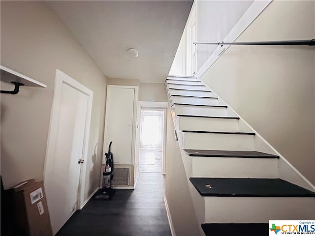 stairway featuring hardwood / wood-style flooring