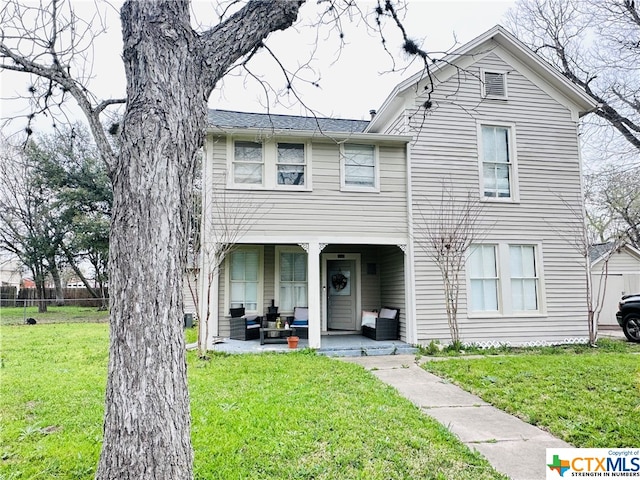 view of front of property with a front lawn and an outdoor hangout area