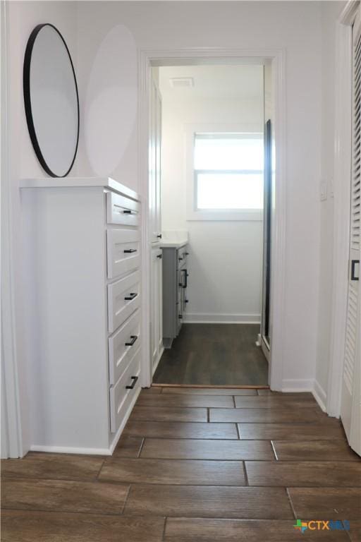 2704 Loma Vista Ave, Victoria, TX 77901 - corridor with dark wood-style flooring and baseboards