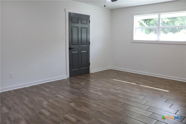 2704 Loma Vista Ave, Victoria, TX 77901 - empty room with dark wood-type flooring and a ceiling fan