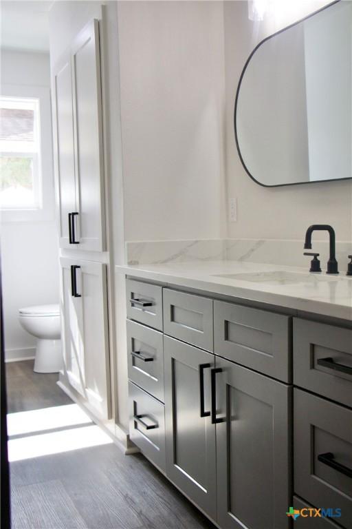 2704 Loma Vista Ave, Victoria, TX 77901 - bathroom with vanity and wood finished floors