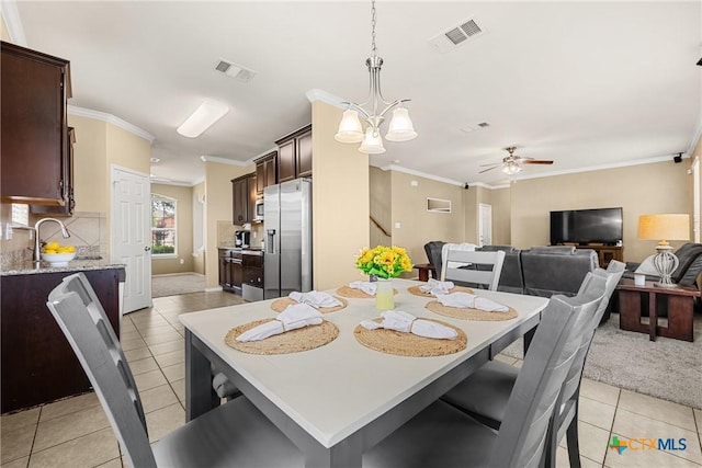 1103 Sugar Brook Dr, Temple, TX 76502 - dining space featuring light tile patterned floors, ornamental molding, and a ceiling fan